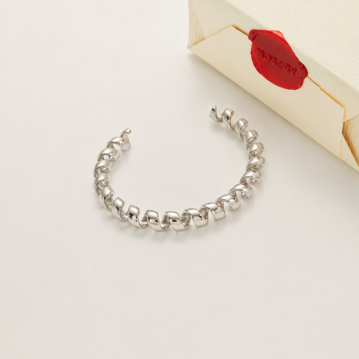 Silver bracelet with Nucery wax seal packaging