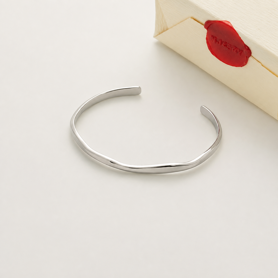Silver bangle with Nucery wax seal packaging