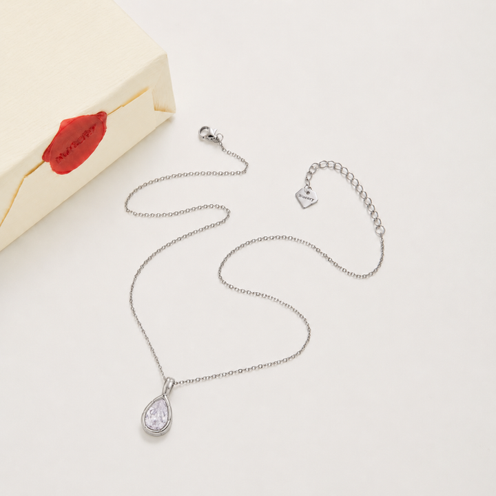 Silver necklace with Nucery wax seal packaging