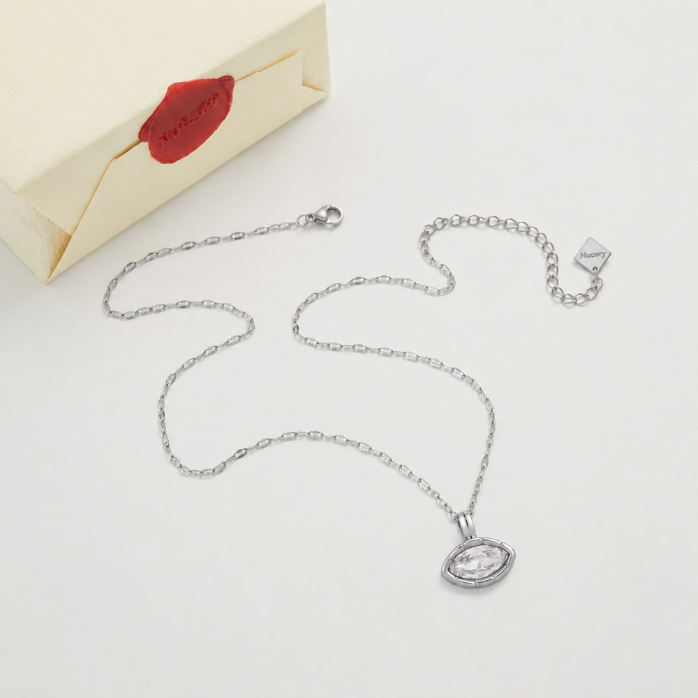 Silver necklace with Nucery wax seal packaging