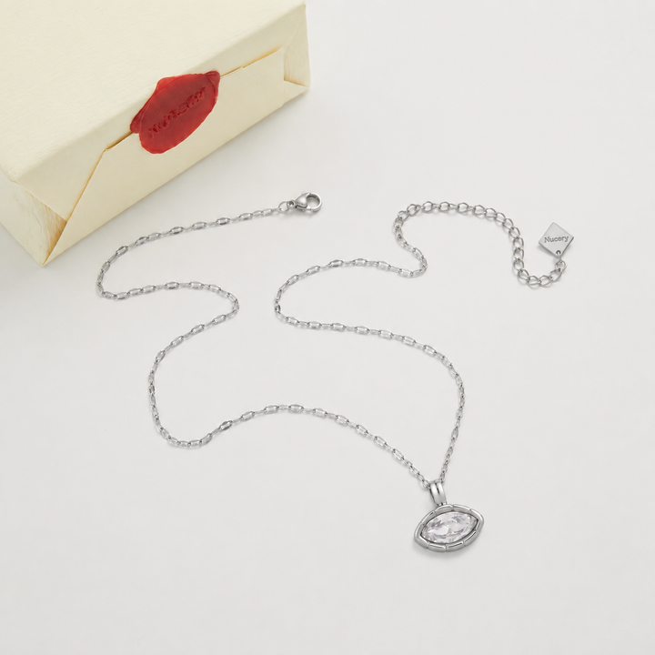 Silver necklace with Nucery wax seal packaging