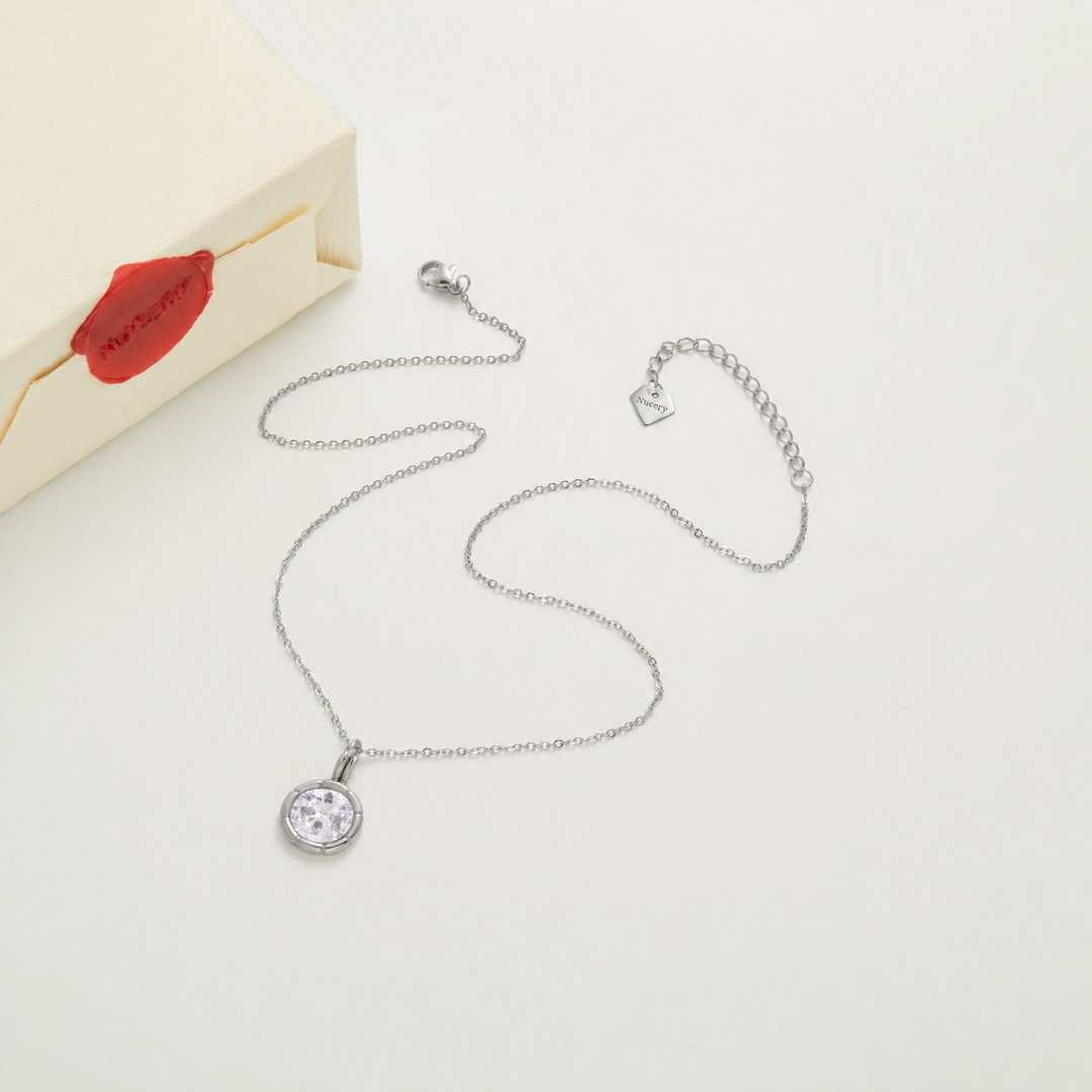 Silver necklace with Nucery wax seal packaging