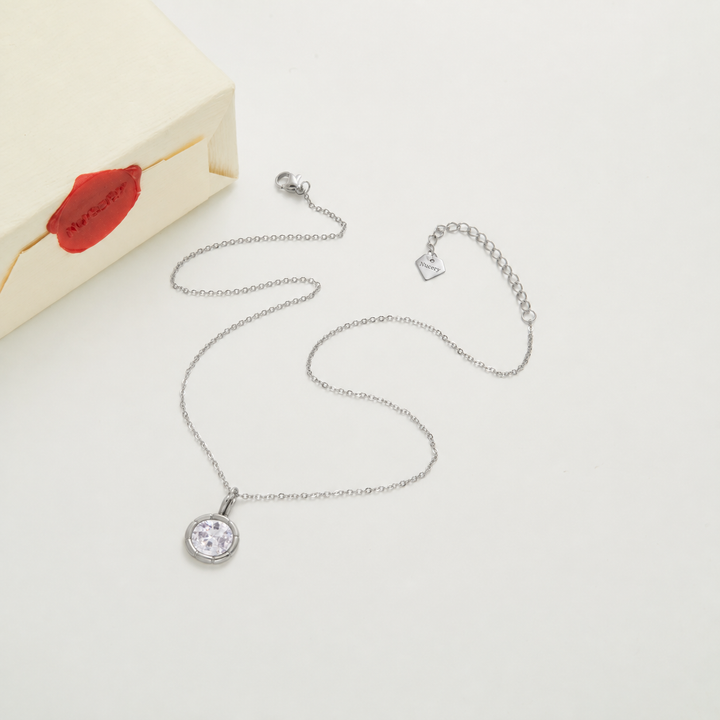 Silver necklace with Nucery wax seal packaging