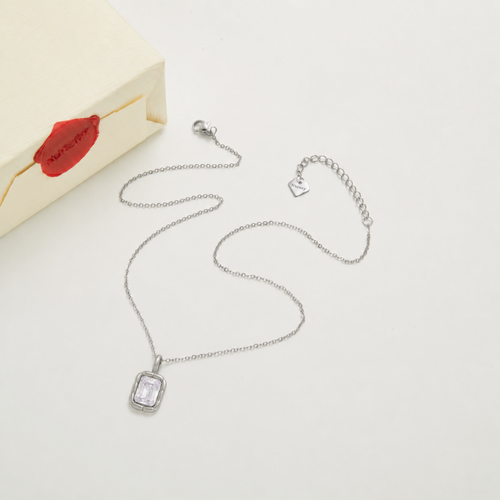 Silver necklace with Nucery wax seal packaging