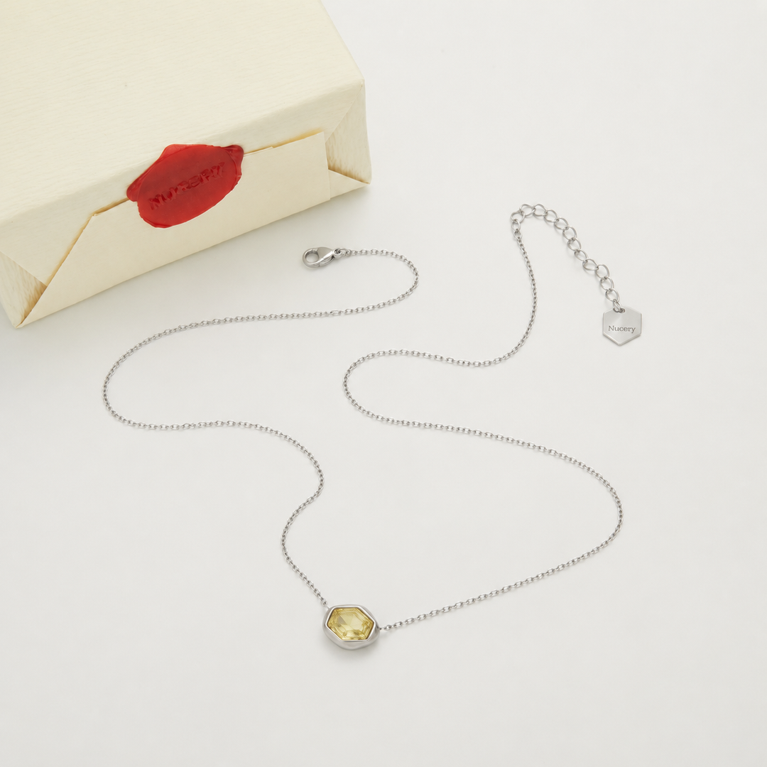 Silver necklace with Nucery wax seal packaging