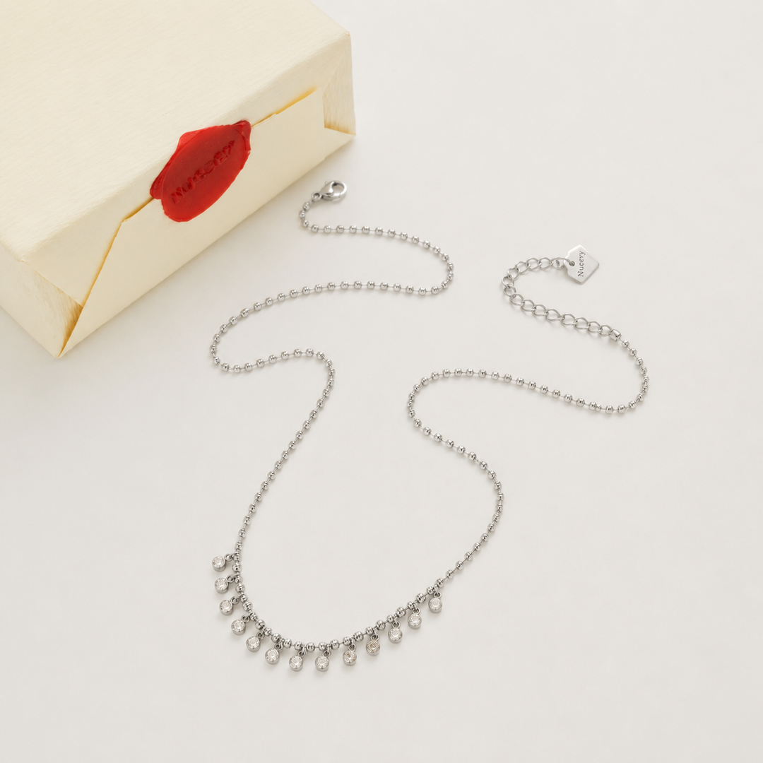 Silver necklace with Nucery wax seal packaging