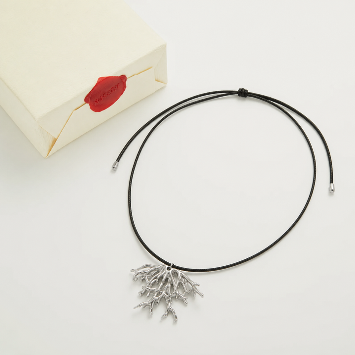 Silver necklace with Nucery wax seal packaging