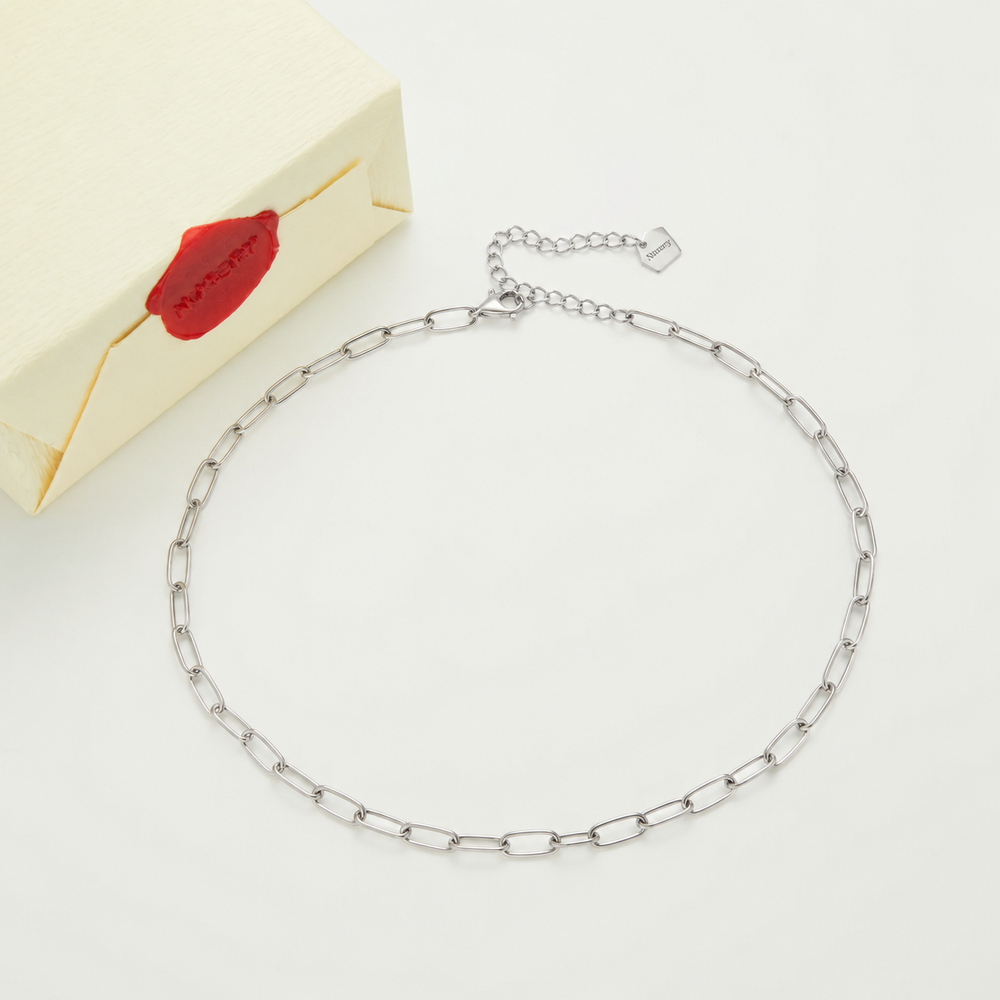 Silver necklace with Nucery wax seal packaging