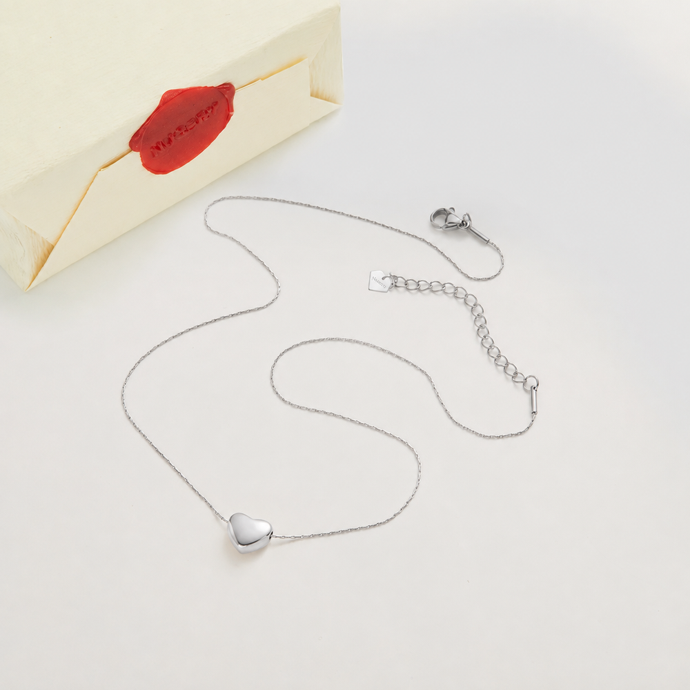 Silver necklace with Nucery wax seal packaging