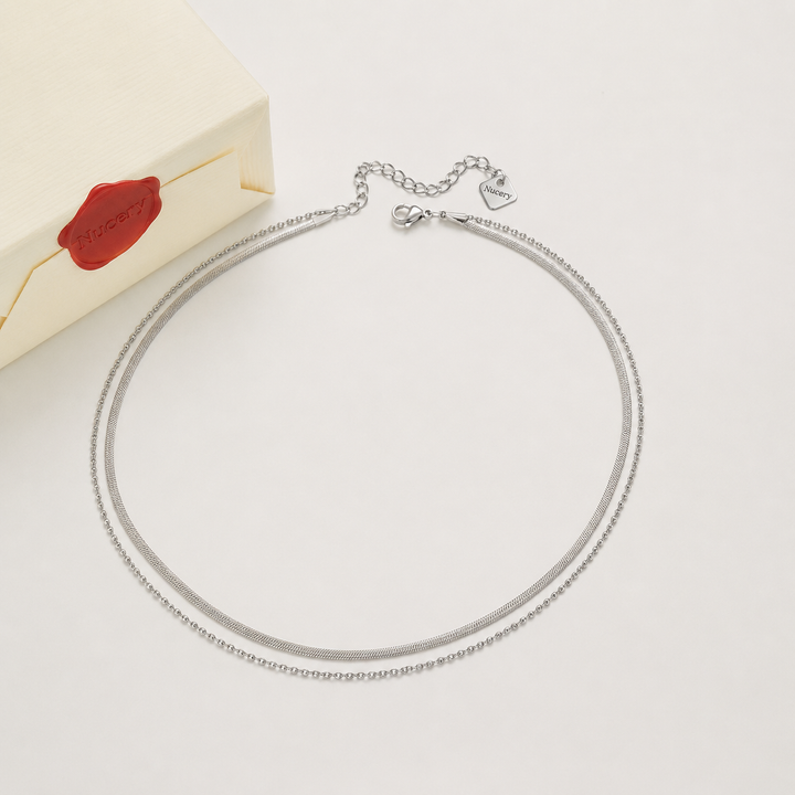 Silver necklace with Nucery wax seal packaging