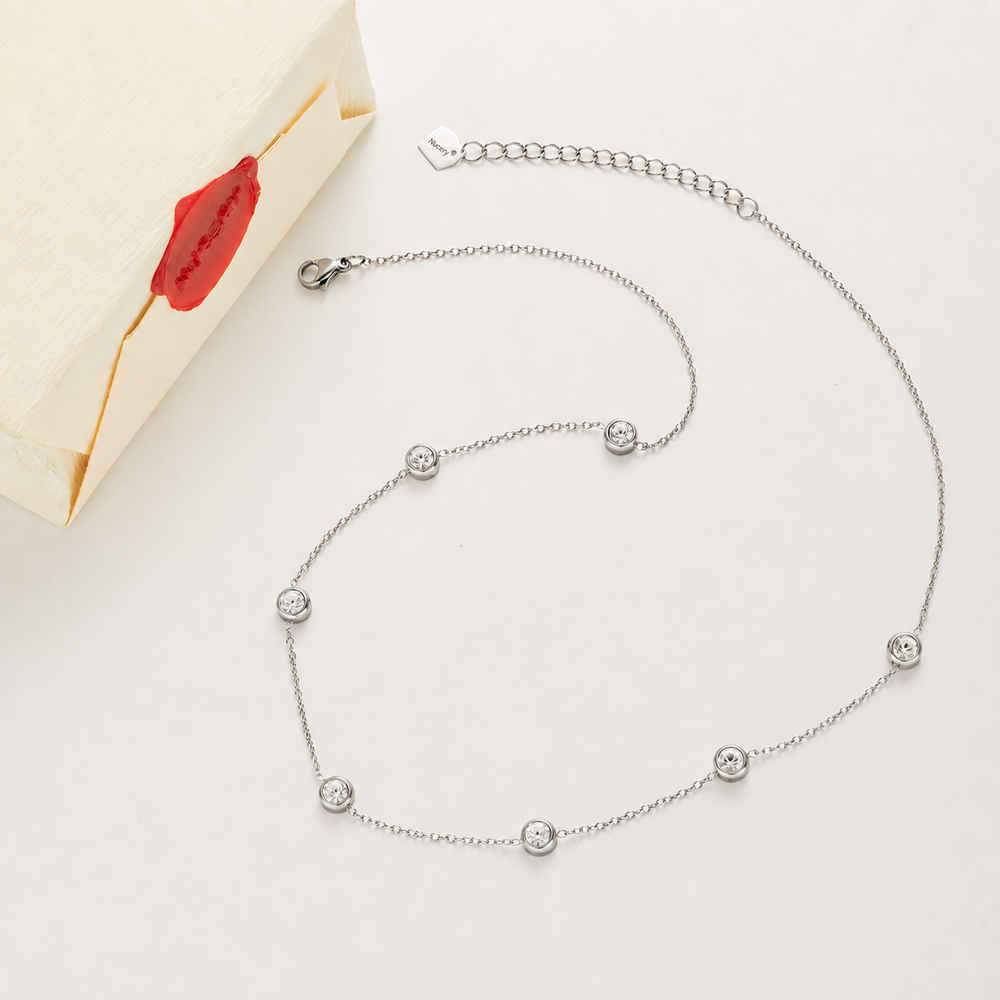 Silver necklace with Nucery wax seal packaging