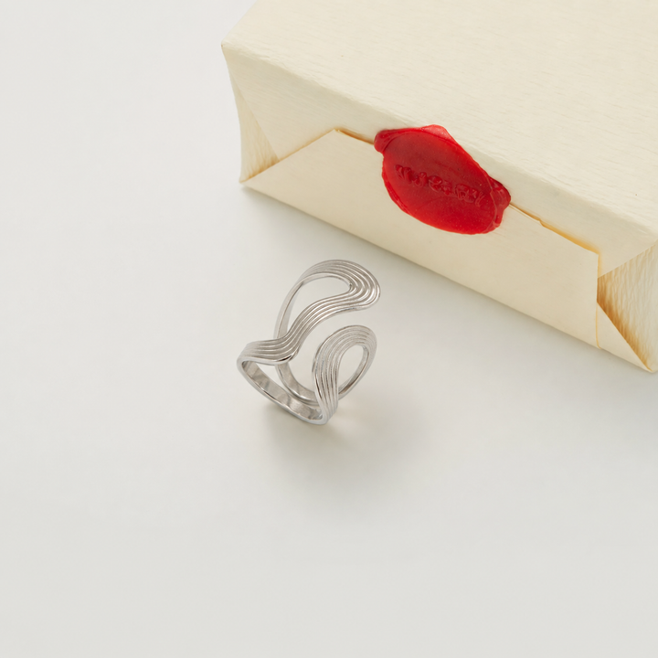 Silver ring with Nucery wax seal packaging