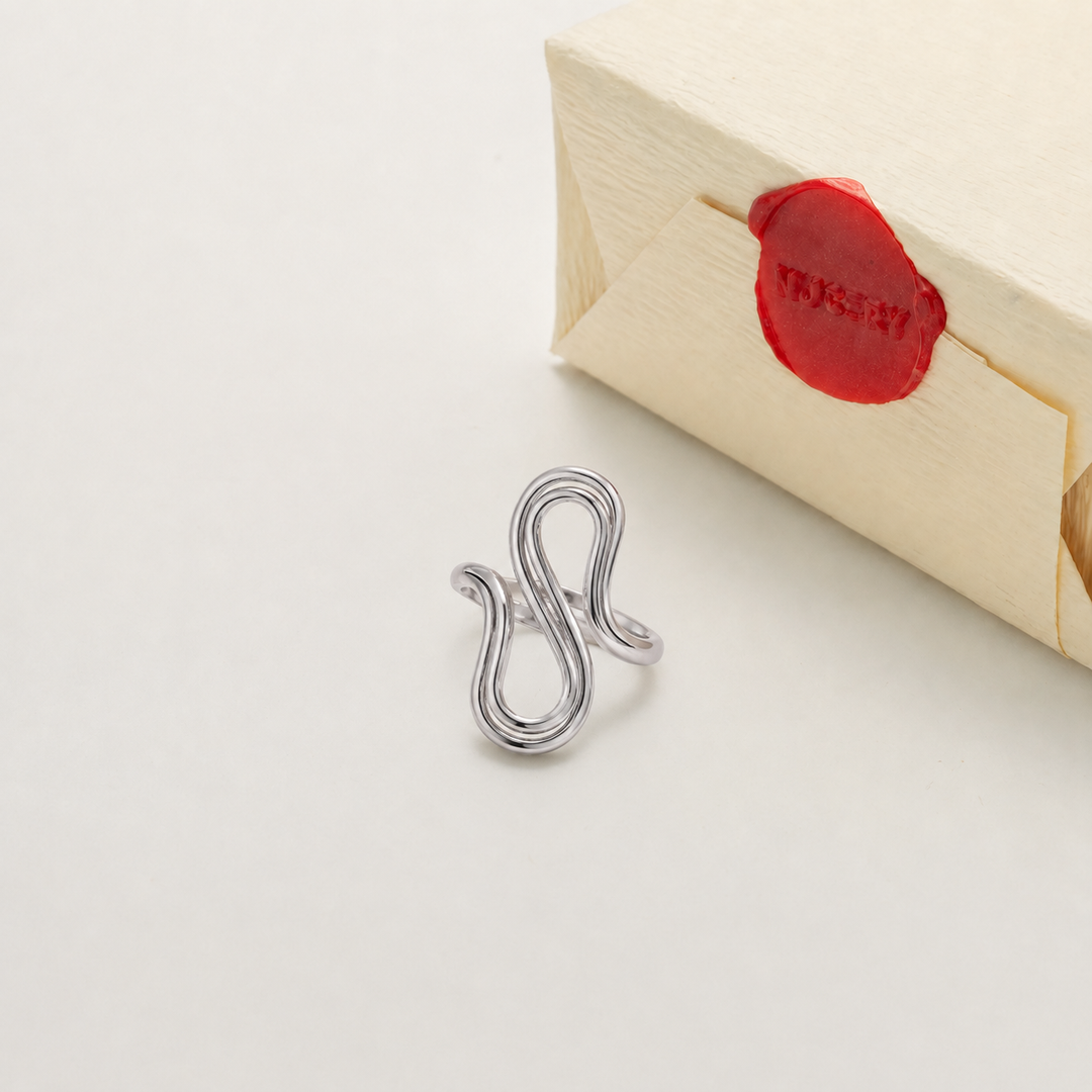 Silver ring with Nucery wax seal packaging