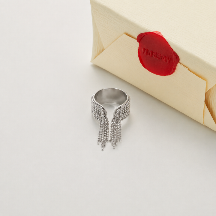 Silver ring with chain fringe and Nucery wax seal packaging