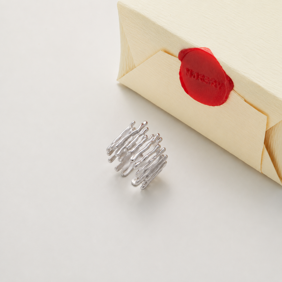 Silver ring with Nucery wax seal packaging