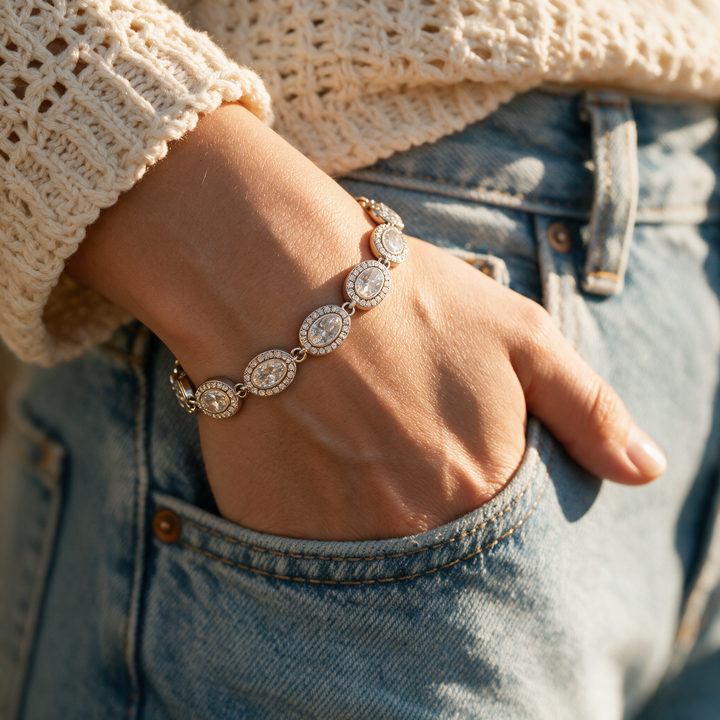 Silver bracelet worn on wrist, golden hour denim