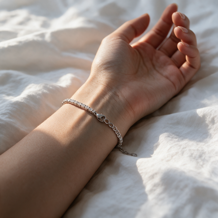 Silver bracelet worn on wrist