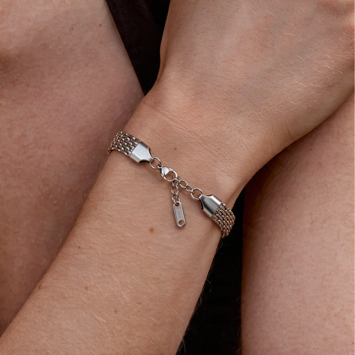 Silver bracelet worn on wrist