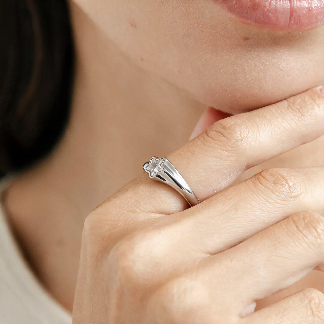 Silver star wrap ring worn on hand