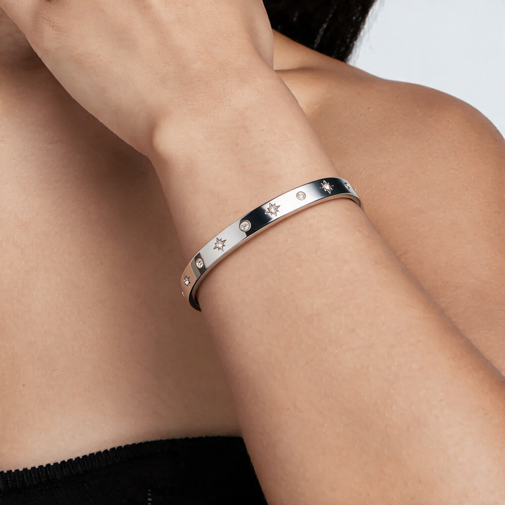 Silver bracelet worn on wrist