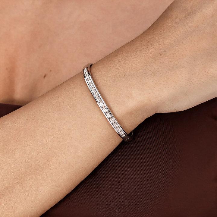 Silver bracelet worn on wrist