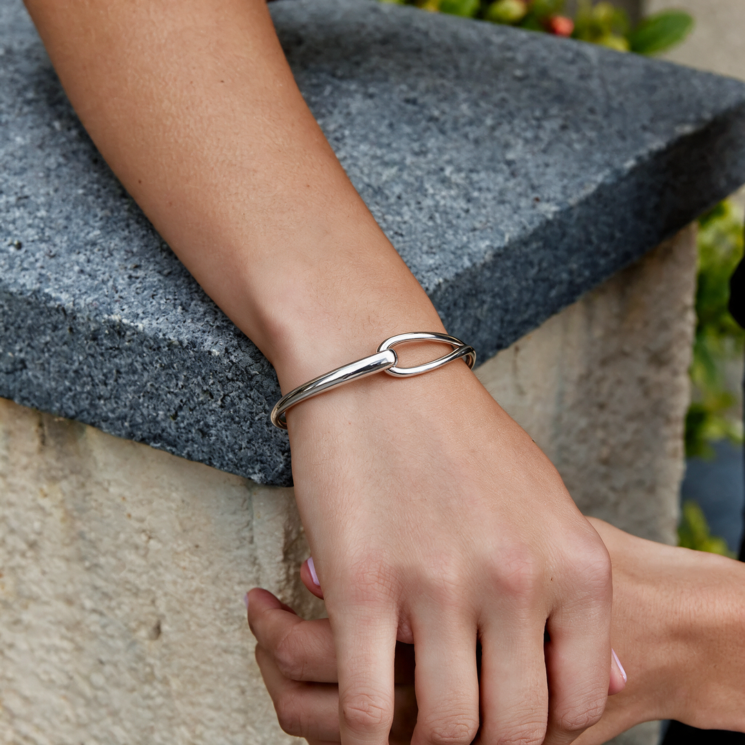 Silver bracelet worn on wrist
