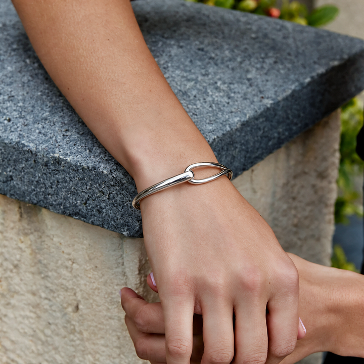 Silver bracelet worn on wrist