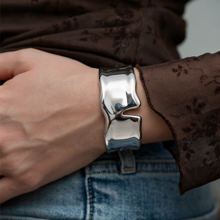 Silver bracelet worn on wrist
