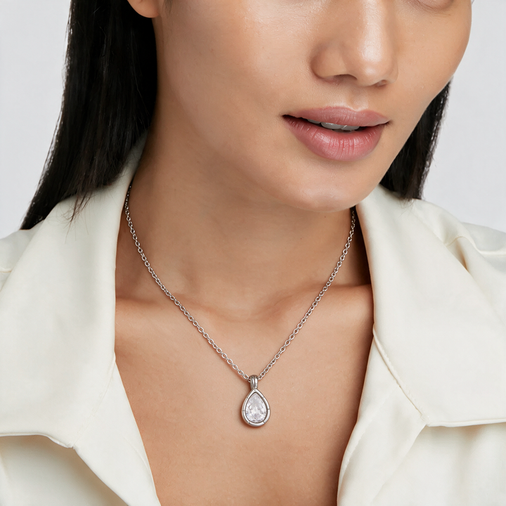 Silver necklace worn on neck