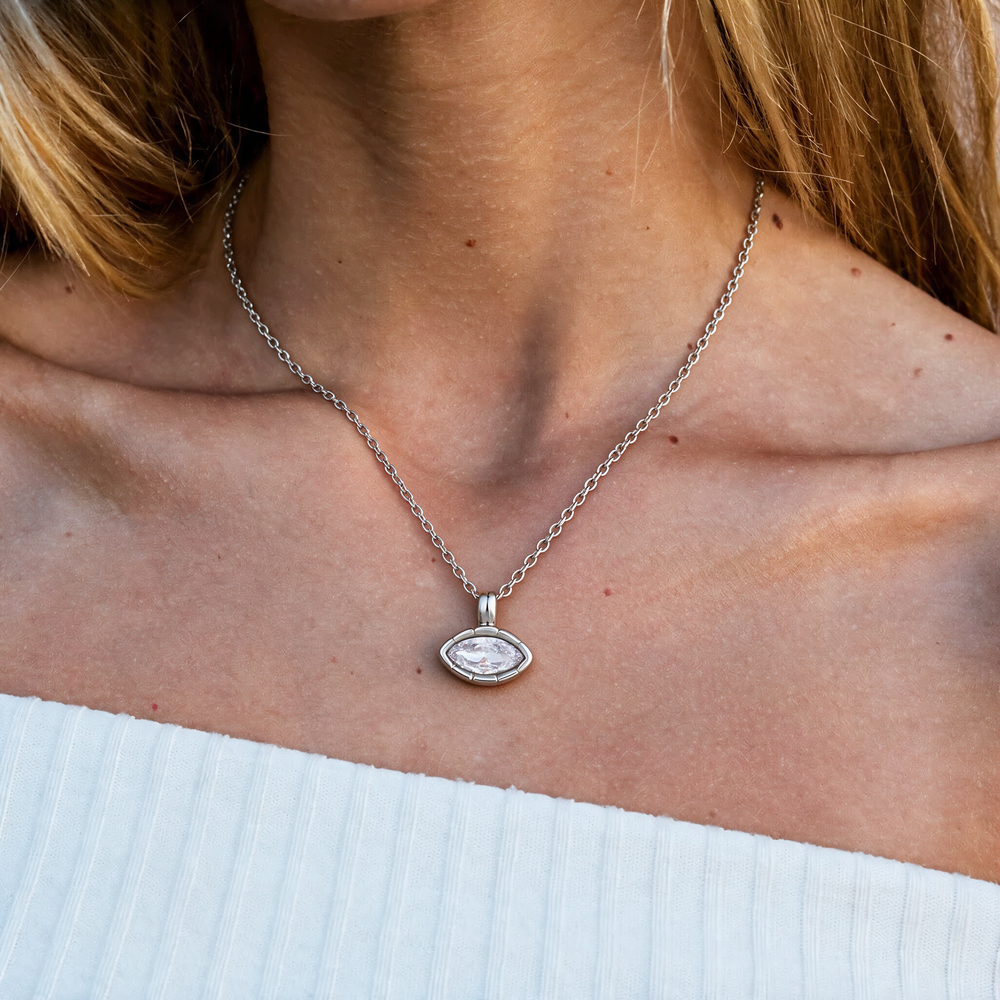 Silver necklace worn on neck
