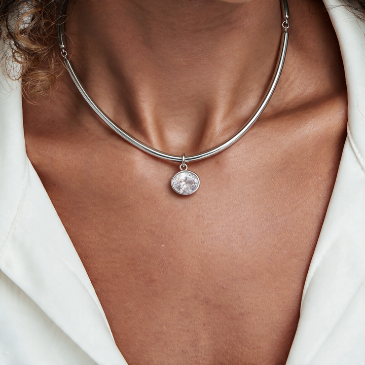 Silver necklace worn on neck