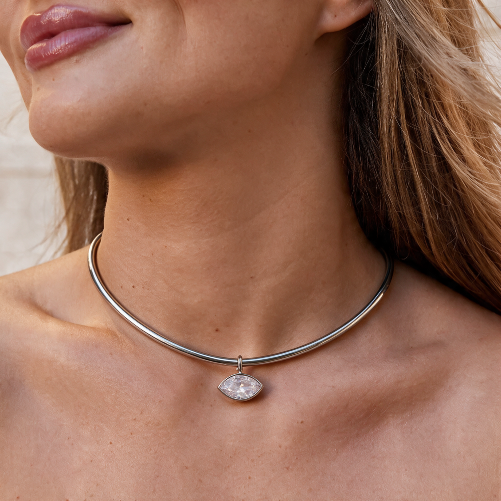 Silver necklace worn on neck