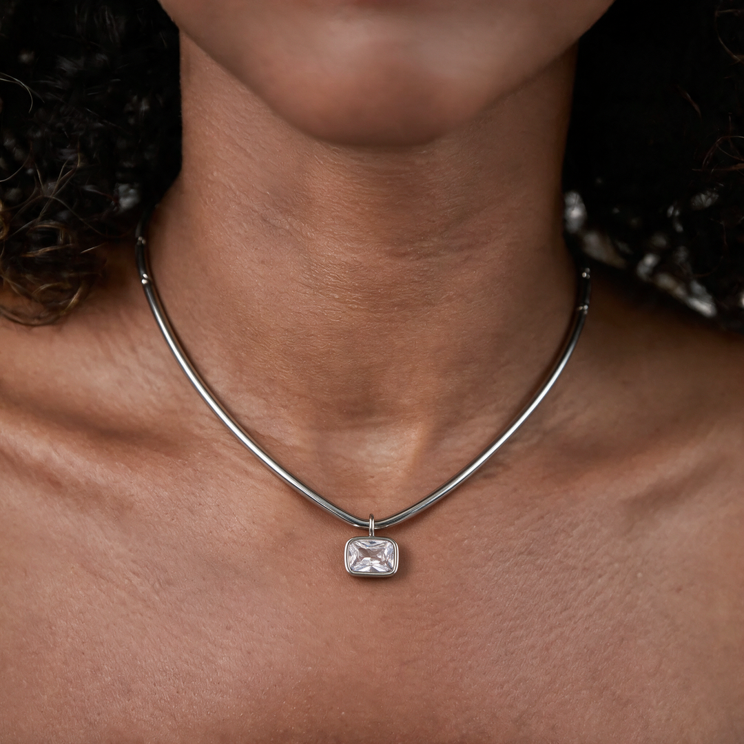 Silver necklace worn on neck