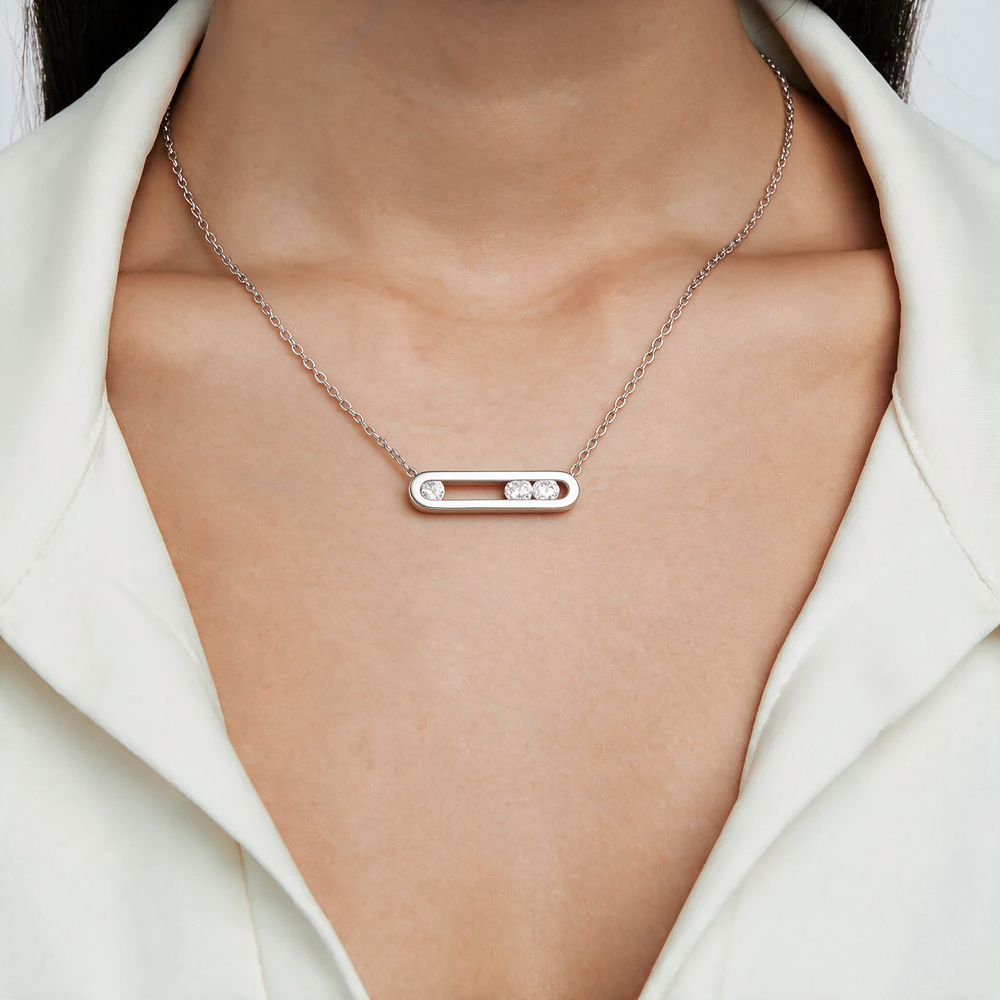 Silver necklace worn on neck