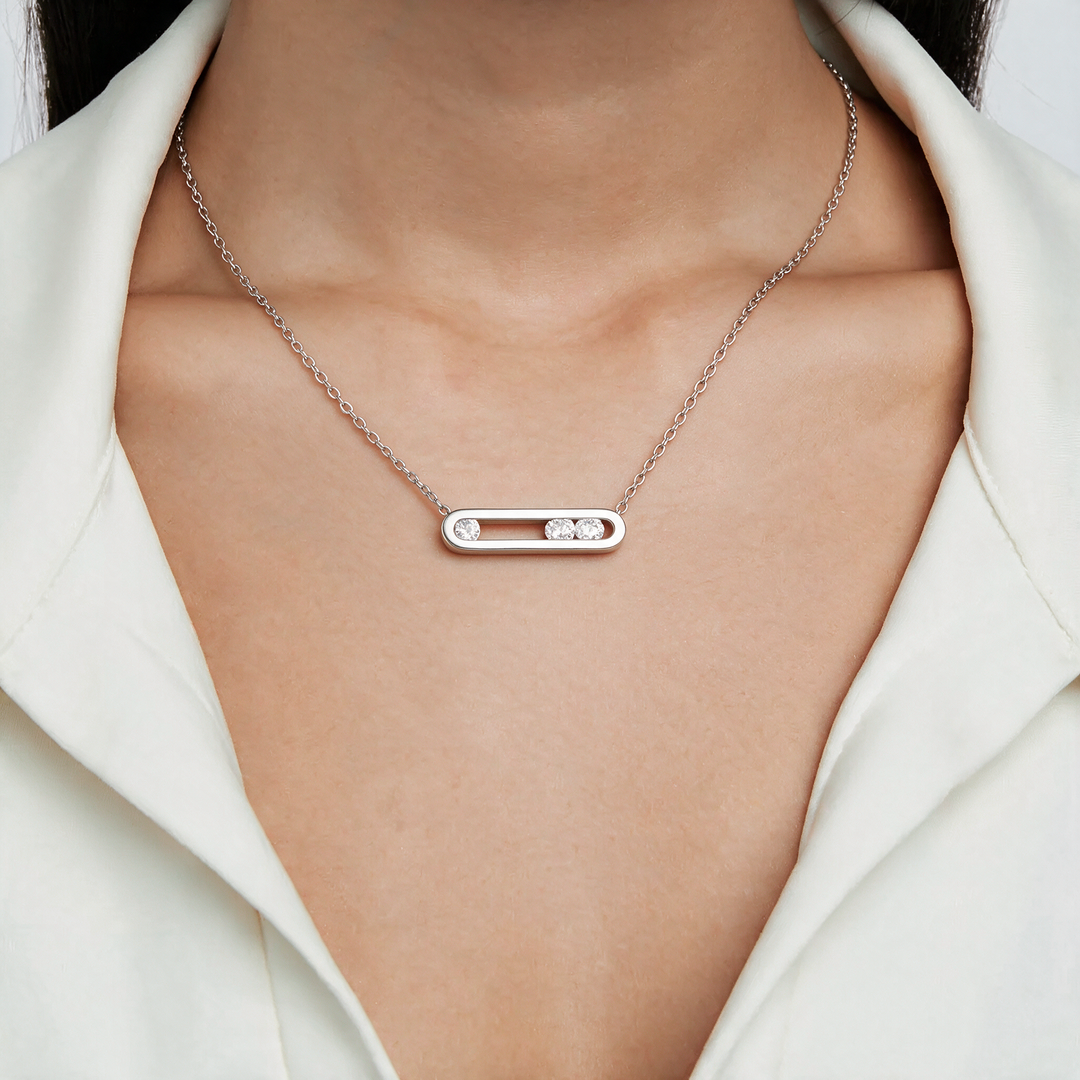 Silver necklace worn on neck