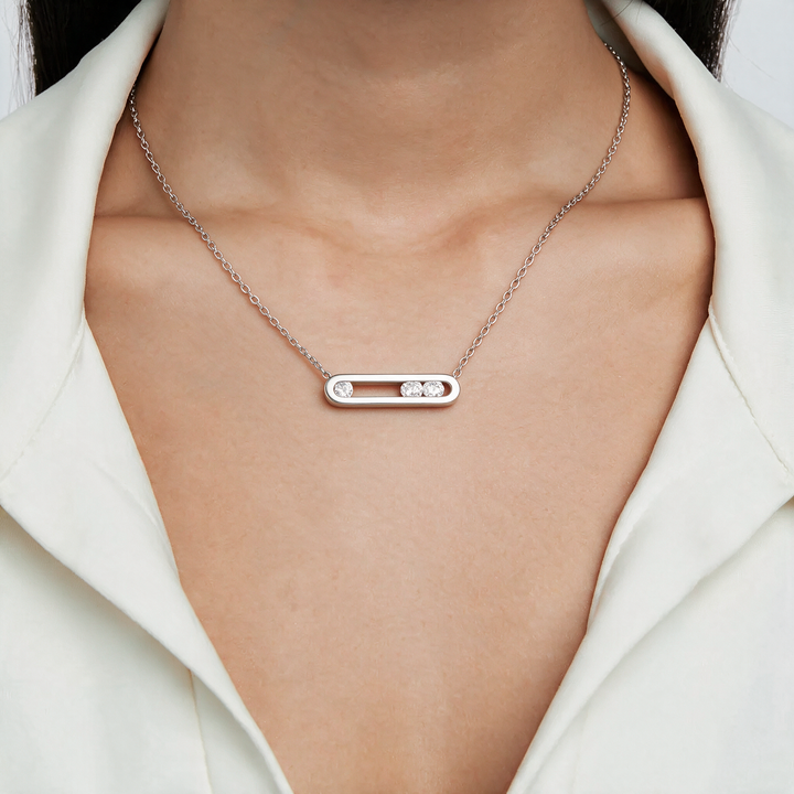 Silver necklace worn on neck