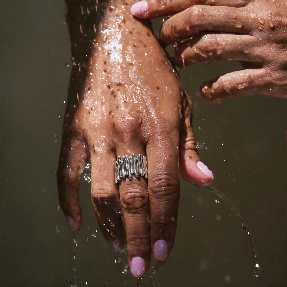 Silver ring worn on hand