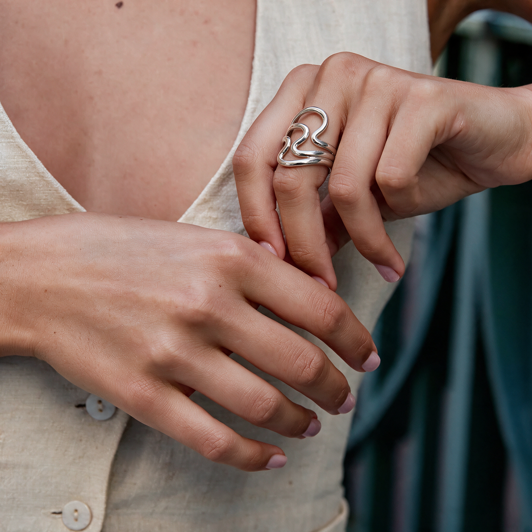 Silver ring worn on hand