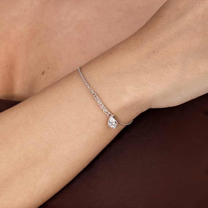 Silver necklace worn on neck
