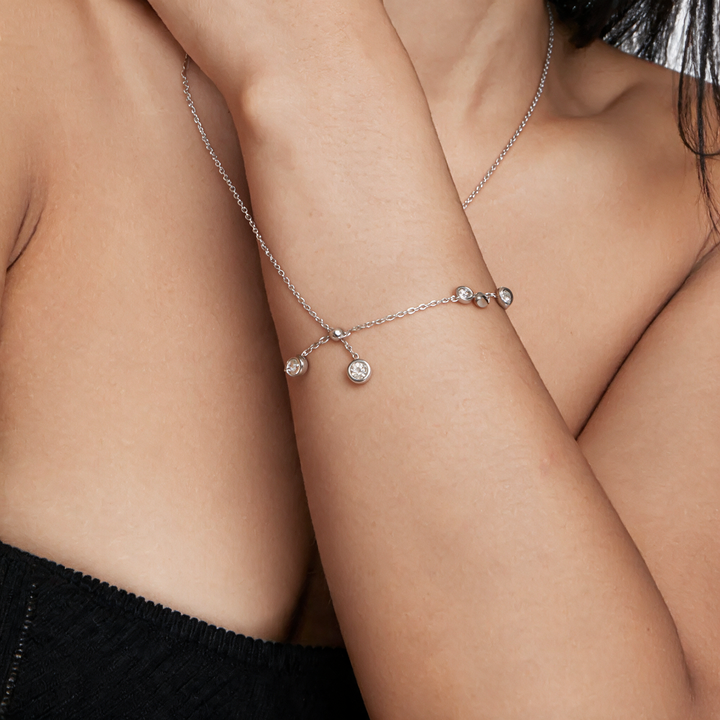 Silver necklace worn on neck