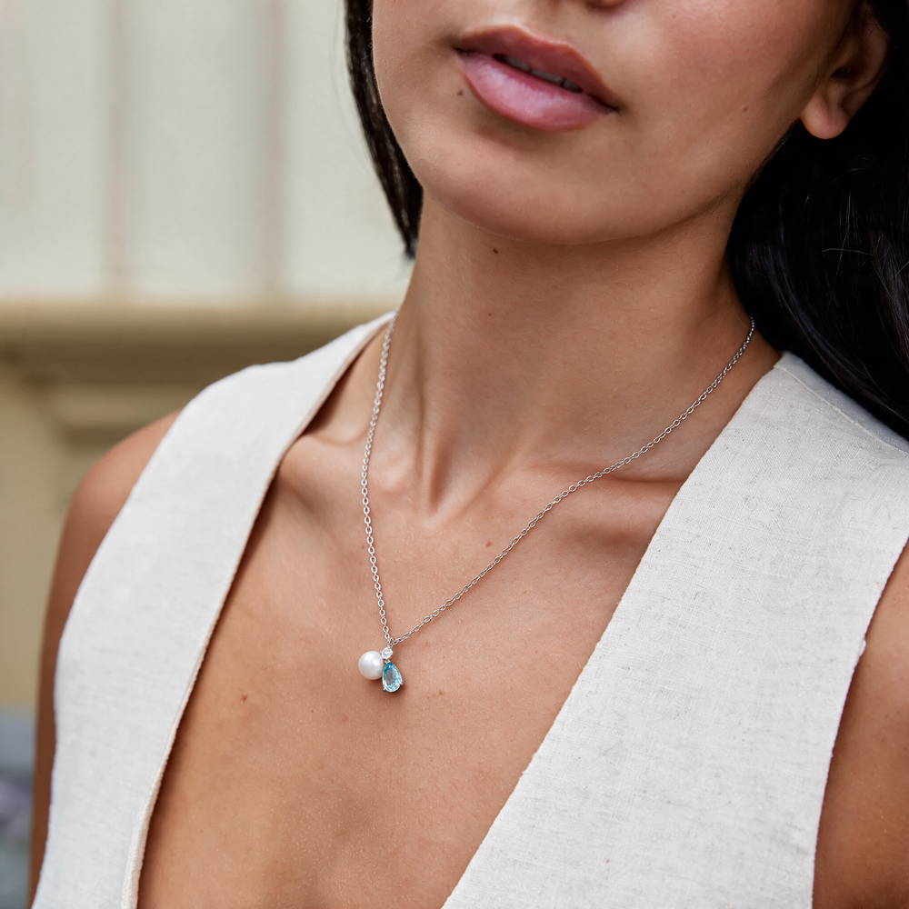 Silver necklace worn on neck